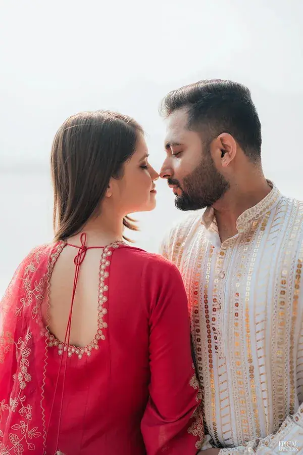 Sagar and Pritika close together beside the lake
