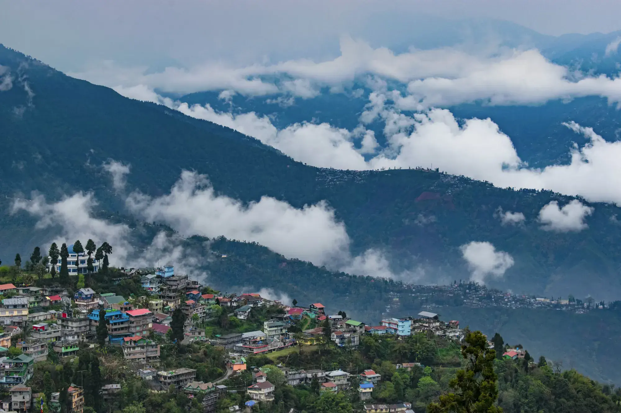 A hill town beneath a sea of clouds in the Himalayan foothills