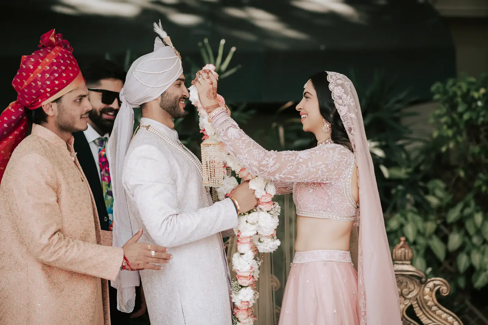 The varmala exchanged as the family looks on